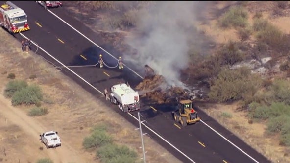 Pickup truck towing hay starts fire on US 60
