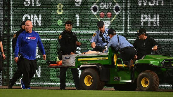 Fan who fell to warning track at a Pirates game takes first steps since accident