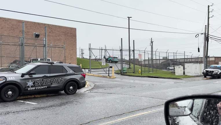 Bibb County sheriff’s deputies surround the jail after a report of a fight on June 4, 2025.